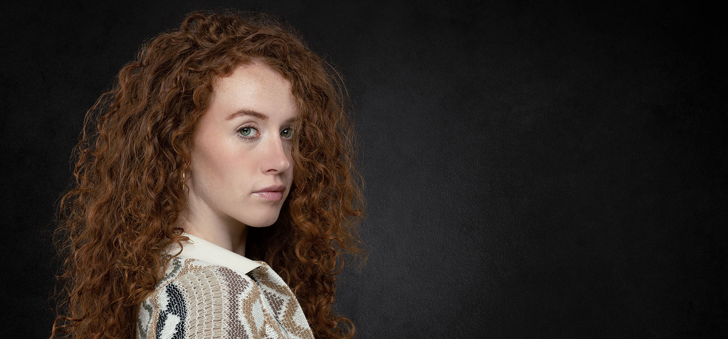 Mel Pettit Photography - Headshot portrait - A redhead in a side on profile portrait